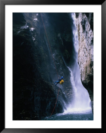 Man Canyoning In Waterfall, Nepal by Anders Blomqvist Pricing Limited Edition Print image