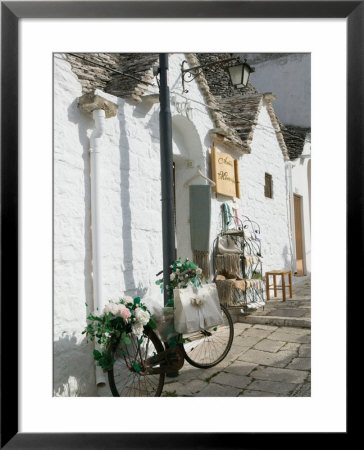 Souvenir Shop Bicycle, Unesco World Heritage Site, Terra Dei Trulli, Alberobello, Puglia, Italy by Walter Bibikow Pricing Limited Edition Print image