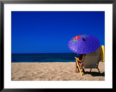 A Girl On The Beach Shading Under A Colourful Umbrella, Waikiki, Oahu, Hawaii, Usa by Ann Cecil Pricing Limited Edition Print image