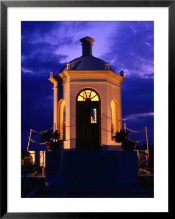 Harbourside Shrine At Puerto Banus Illuminated Against The Evening Sky, Marbella, Andalucia, Spain by David Tomlinson Pricing Limited Edition Print image