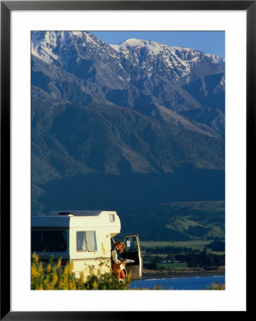 Woman Reading Map In Campervan With Mountain Behind, Kaikoura, New Zealand by Philip & Karen Smith Pricing Limited Edition Print image