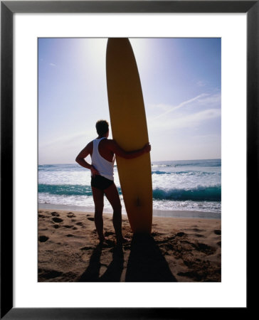 Surf Life-Saver Standing With Long-Board On Narrabeen Beach, Sydney, Australia by Trevor Creighton Pricing Limited Edition Print image