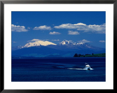 Boat Sailing With Mt. Ruapehu, Mt. Ngauruhoe And Mt. Tongariro In Background, New Zealand by Barnett Ross Pricing Limited Edition Print image