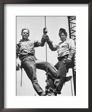 Construction Workers Standing On A Wreaking Ball by Ralph Crane Pricing Limited Edition Print image