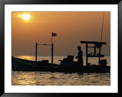 A Silhouetted Boat Fishing For Soft Crabs by Robert Madden Pricing Limited Edition Print image