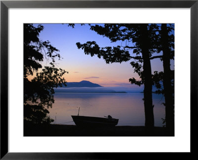 Silhouette Of A Motor Boat On The Shores Of A Bay In Alaska by Joel Sartore Pricing Limited Edition Print image