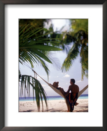 Silhouetted Couple, Felidu Atoll, Maldives by Stuart Westmoreland Pricing Limited Edition Print image