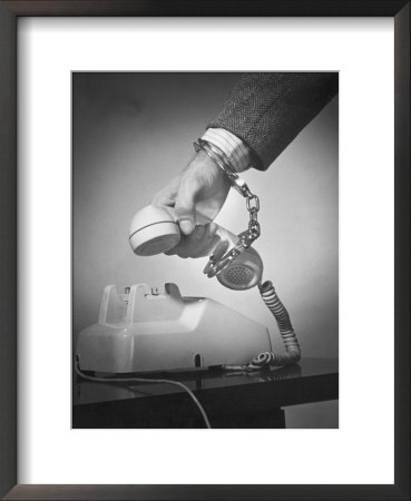 Hand Handcuffed To Telephone by Ewing Galloway Pricing Limited Edition Print image