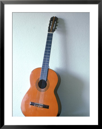 Guitar Leaning Against A Wall by Dr. Luis De La Maza Pricing Limited Edition Print image