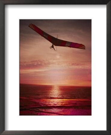 Silhouette Of A Hang Glider Over The Ocean by Richard Stacks Pricing Limited Edition Print image