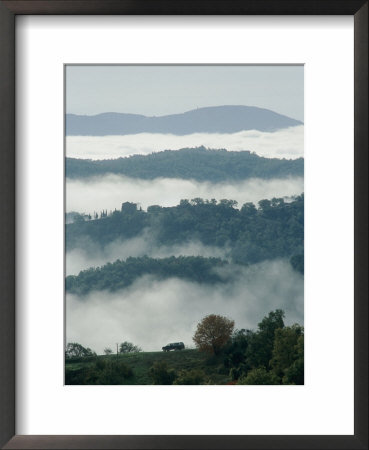 A Car Drives Along A Scenic Road That Winds Around A Mountaintop by Tino Soriano Pricing Limited Edition Print image