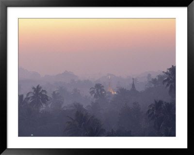 The Tips Of Pagodas Can Be Seen Amongst Forest Treetops by Steve Winter Pricing Limited Edition Print image