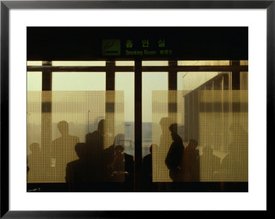 People Silhouetted In Smoking Room At Gimpo Airport, Seoul, South Korea by Johnson Dennis Pricing Limited Edition Print image