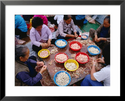 Women Peeling Prawns On Table In Cheng Chau, Hong Kong by Jon Davison Pricing Limited Edition Print image