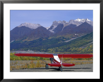 Supercub And The Wrangell Mountains In Mccarthy, Alaska by Rich Reid Pricing Limited Edition Print image