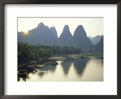 In Guilin Limestone Tower Hills Rise Steeply Above The Li River, Yangshuo, Guangxi Province, China by Anthony Waltham Pricing Limited Edition Print image
