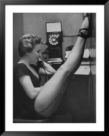 Dancer Mary Ellen Terry Talking With Her Legs Up In Telephone Booth by Gordon Parks Pricing Limited Edition Print image