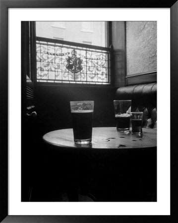 Half Empty Glasses Of Beer Left On Table In The Blue Lion Pub In Dublin by Gjon Mili Pricing Limited Edition Print image