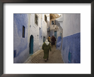Woman Walking Through Pastel Coloured Streets Of Chefchaouen, Morocco, North Africa, Africa by Christian Kober Pricing Limited Edition Print image