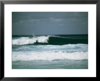 Surfer Rides A Rolling Wave In The Bonsai Pipeline In Oahu by Todd Gipstein Pricing Limited Edition Print image