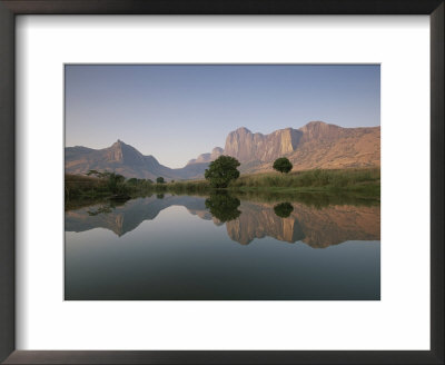 Limestone Rock Formations Are Reflected In Still Waters by Michael Melford Pricing Limited Edition Print image