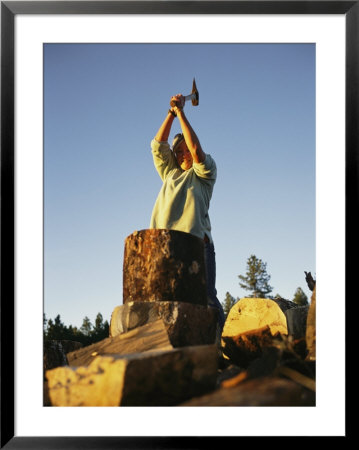 A Woman Chops Wood With An Axe by Bobby Model Pricing Limited Edition Print image