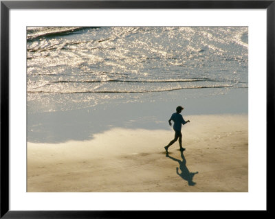 A Jogger Runs Along The Beach by Joel Sartore Pricing Limited Edition Print image