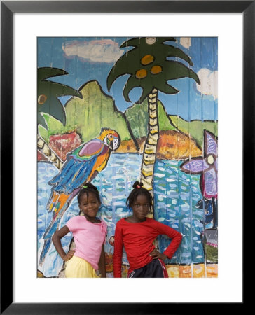Girls In Front Of Mural, Paradise Beach, Carriacou And Petit Martinique, Grenada by Holger Leue Pricing Limited Edition Print image
