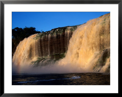 Saltos Hacha Falls, Discoloured By Tannin (Tanino) From Trees And Plants, Canaima, Venezuela by Krzysztof Dydynski Pricing Limited Edition Print image