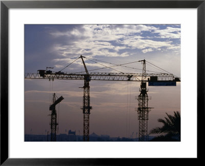Construction Site Cranes At Sunset, Dubai, United Arab Emirates by Phil Weymouth Pricing Limited Edition Print image