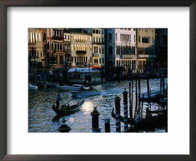 Traditional Gondola Amongst Traffic On Grand Canal, Venice, Italy by Manfred Gottschalk Pricing Limited Edition Print image