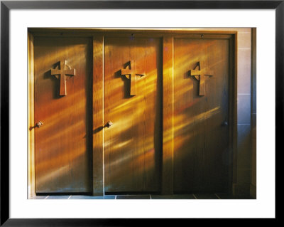 Confessional Doors Are Bathed In Soft Sunlight Shining Through Stained Glass Windows by Brian Gordon Green Pricing Limited Edition Print image