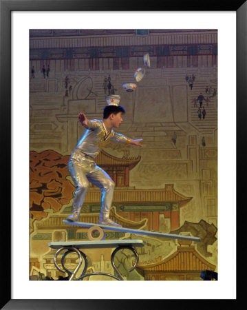 A Juggler Catches Dishes On His Head While Balancing by Richard Nowitz Pricing Limited Edition Print image