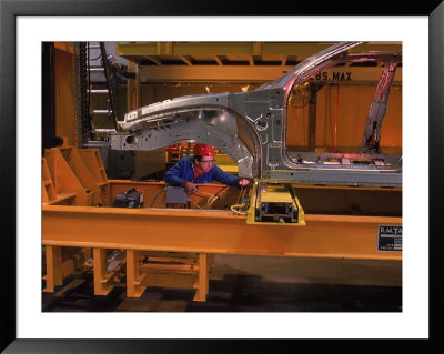 Man Working On Auto Assembly Line, Mo by Ed Lallo Pricing Limited Edition Print image