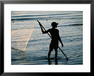 Fisherman Pulling Fishing Net In Sea, Sadani Game Reserve, Tanzania by Ariadne Van Zandbergen Pricing Limited Edition Print image