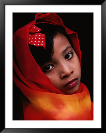 A Portrait Of A Muslim Girl With Her Face Framed By A Colourful Scarf, Indonesia by Adams Gregory Pricing Limited Edition Print image