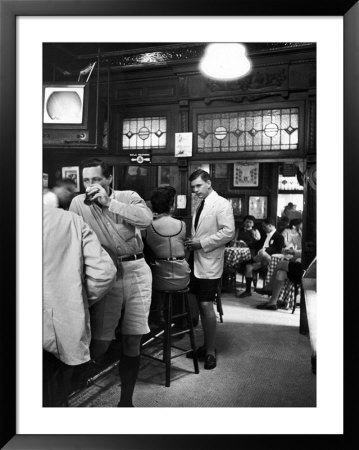 Patrons Inside P.J. Clarke's Saloon Include Men Wearing Bermuda Shorts, A New Fad by Alfred Eisenstaedt Pricing Limited Edition Print image