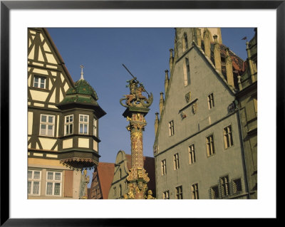 Buildings And Statue Of St. George And The Dragon, Rothenburg, Germany by Steve Satushek Pricing Limited Edition Print image