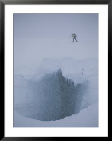 A Skier Above A Deep Glacier Crevasse by John Burcham Pricing Limited Edition Print image