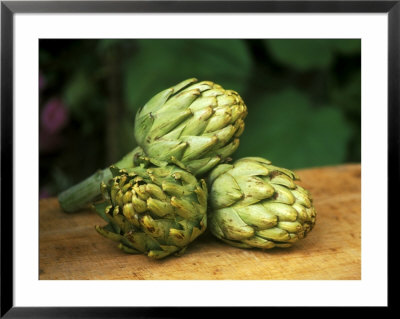 Globe Artichoke Camus On Wooden Table by Michele Lamontagne Pricing Limited Edition Print image