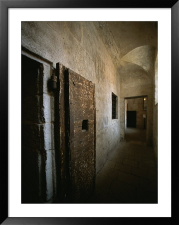Doors To Cells Along A Hallway In The Doges Palace Prison by Todd Gipstein Pricing Limited Edition Print image