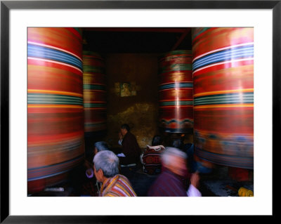 Pilgrims Turning Giant Prayer Wheels In The National Chorten Of Thimphu, Thimphu, Bhutan by Izzet Keribar Pricing Limited Edition Print image