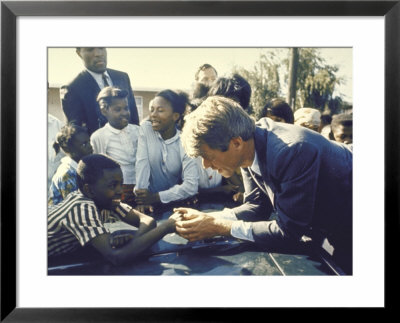 Presidential Contender Bobby Kennedy Stops During Campaigning To Shake Hands African American Boy by Bill Eppridge Pricing Limited Edition Print image