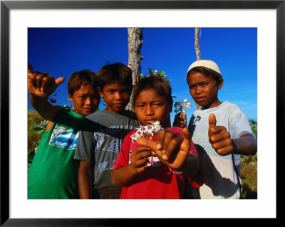 Group Of Boys Holding Flowers, Indonesia by Paul Kennedy Pricing Limited Edition Print image