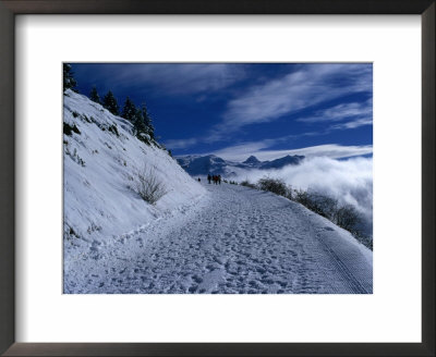 Snow Covered Path In The Alps During Winter, Rhone-Alpes, France by Olivier Cirendini Pricing Limited Edition Print image