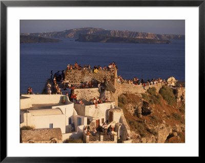 Tourists Watching Sunset, Santorini, Greece by Walter Bibikow Pricing Limited Edition Print image