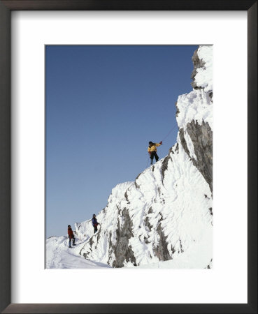 Mountain Climbers Descend A Rime-Plastered Peak by Gordon Wiltsie Pricing Limited Edition Print image