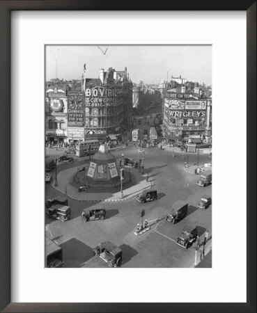 People And Vehicles Bustling Around Piccadilly Circus by David Scherman Pricing Limited Edition Print image