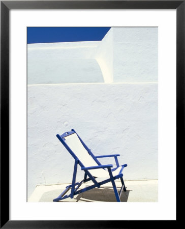 Deckchair Against Whitewashed Wall, Imerovigli, Santorini (Thira), Cyclades Islands, Greece by Lee Frost Pricing Limited Edition Print image