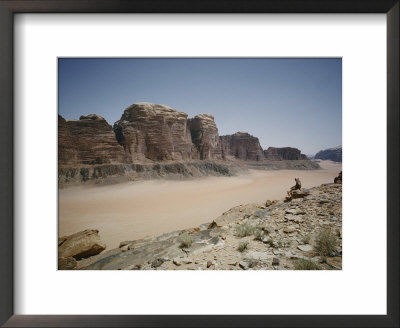 A Man Looks Out Over The Desert Landscape by Luis Marden Pricing Limited Edition Print image